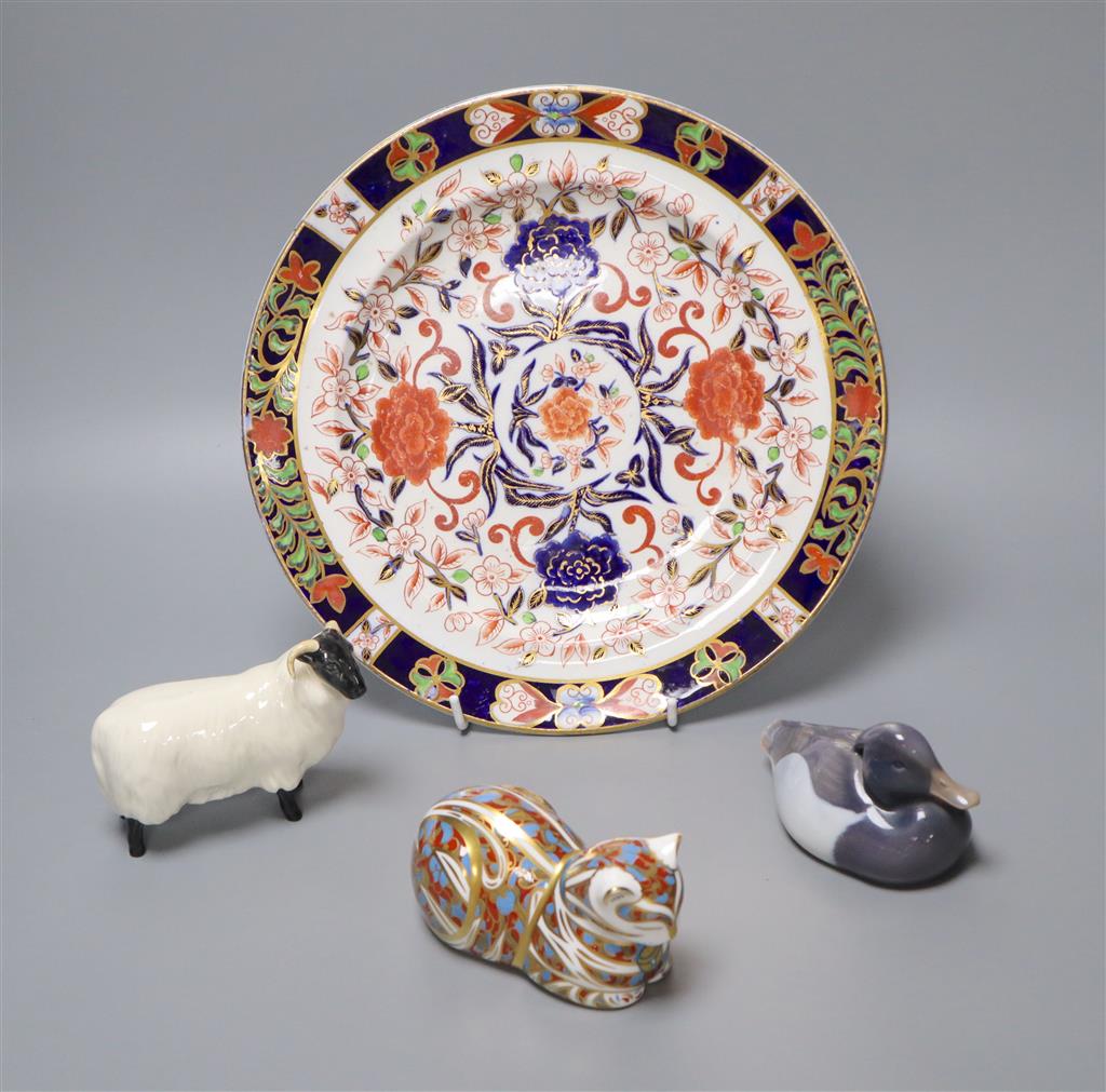 A Crown Derby dish, diameter 26.5cm, a Beswick ram, a Royal Crown Derby flask in the form of a cat and a Royal Copenhagen model of a du